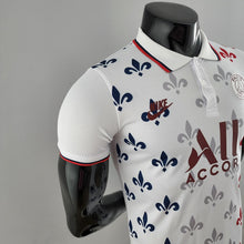 Polo 22/23 PSG Co branded version Blanc